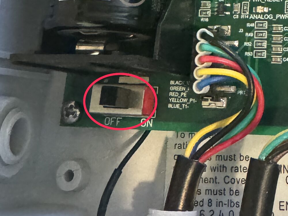 The logger's battery slide switch, marked OFF and ON, circled in red